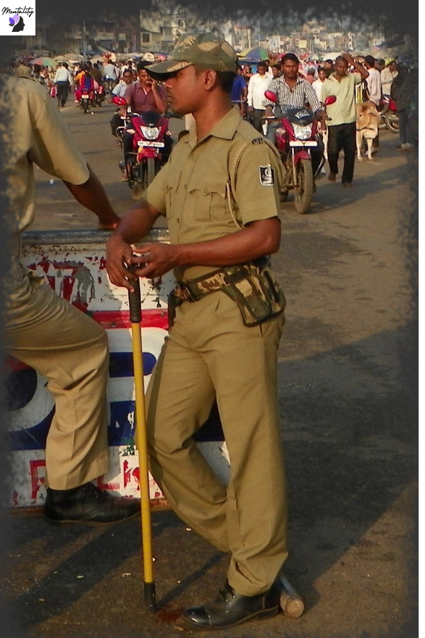 Indian policeman with baton at Jaganath Temple